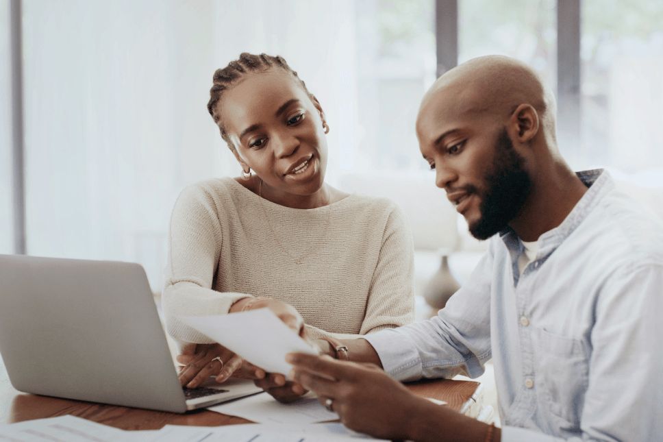 Man and woman discussing financing options for home improvement.