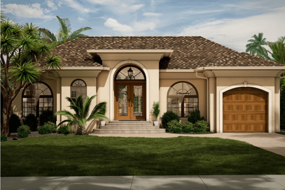 A historic coastal home that has been renovated with new windows, an entry door, and a garage door.