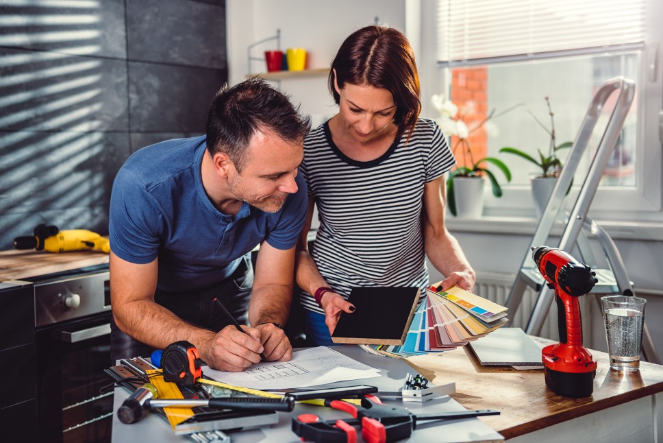 Couple exploring kitchen remodel ideas and new finishes